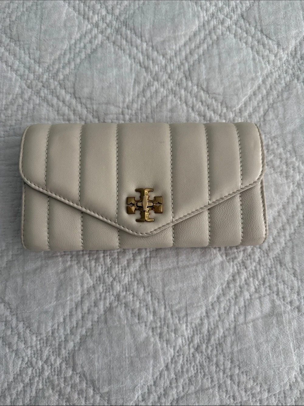 Tory Burch Kira Quilted Envelope Leather  Wallet with turn lock close in Cream
